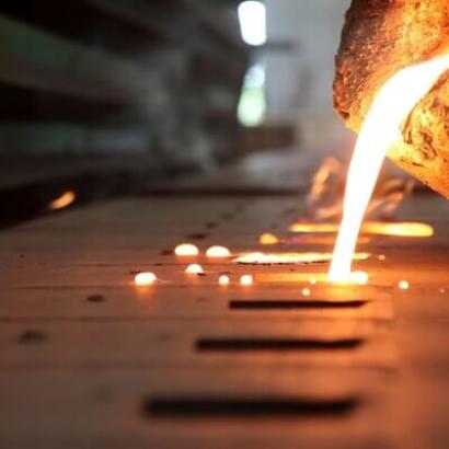 Molten steel being poured into a mold.